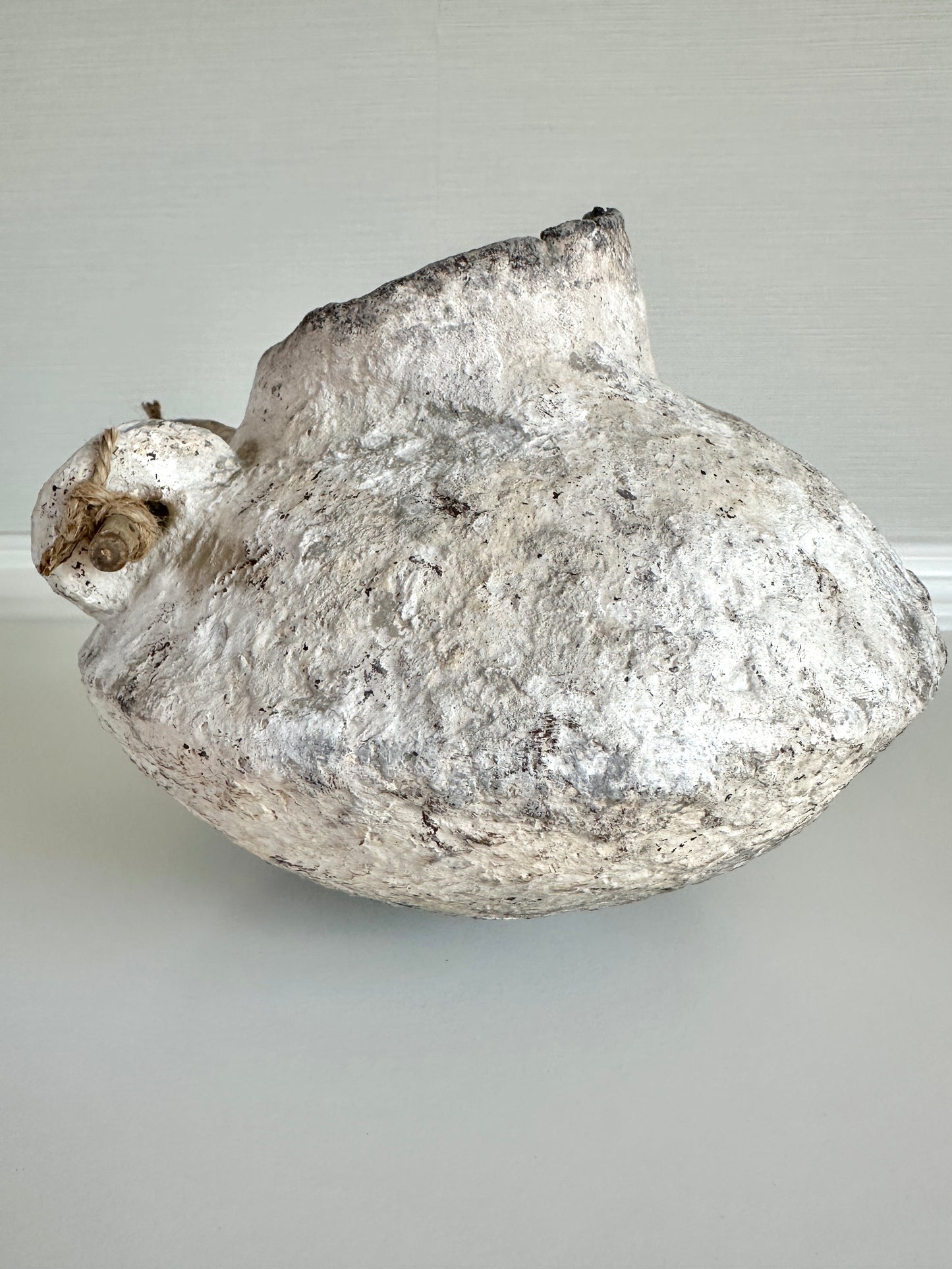 Decorative stone like sculpture on a plain background. Handcrafted original design by artist Tam M Olson