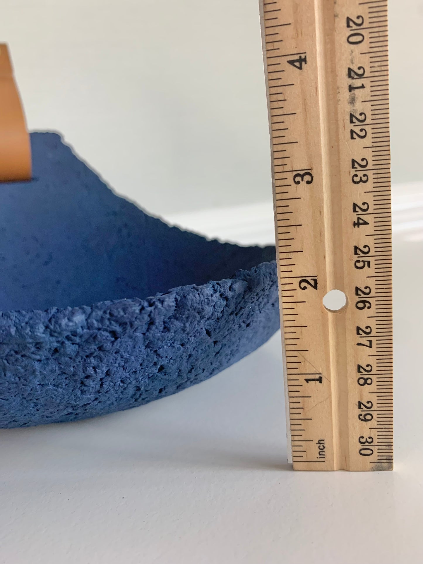 Blue textured paper mache sconce tray sculpture with a leather handle displaying depth of approximately 2 inches by Artist Tam M Olson