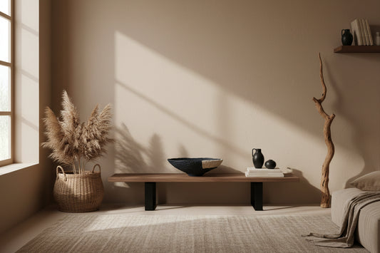 Neutral bedroom with a bench against a wall. On the bench is a beautiful black bowl with twine detail. The bedroom has other natural decor elements. The bowl was designed and created by artist Tam M Olson