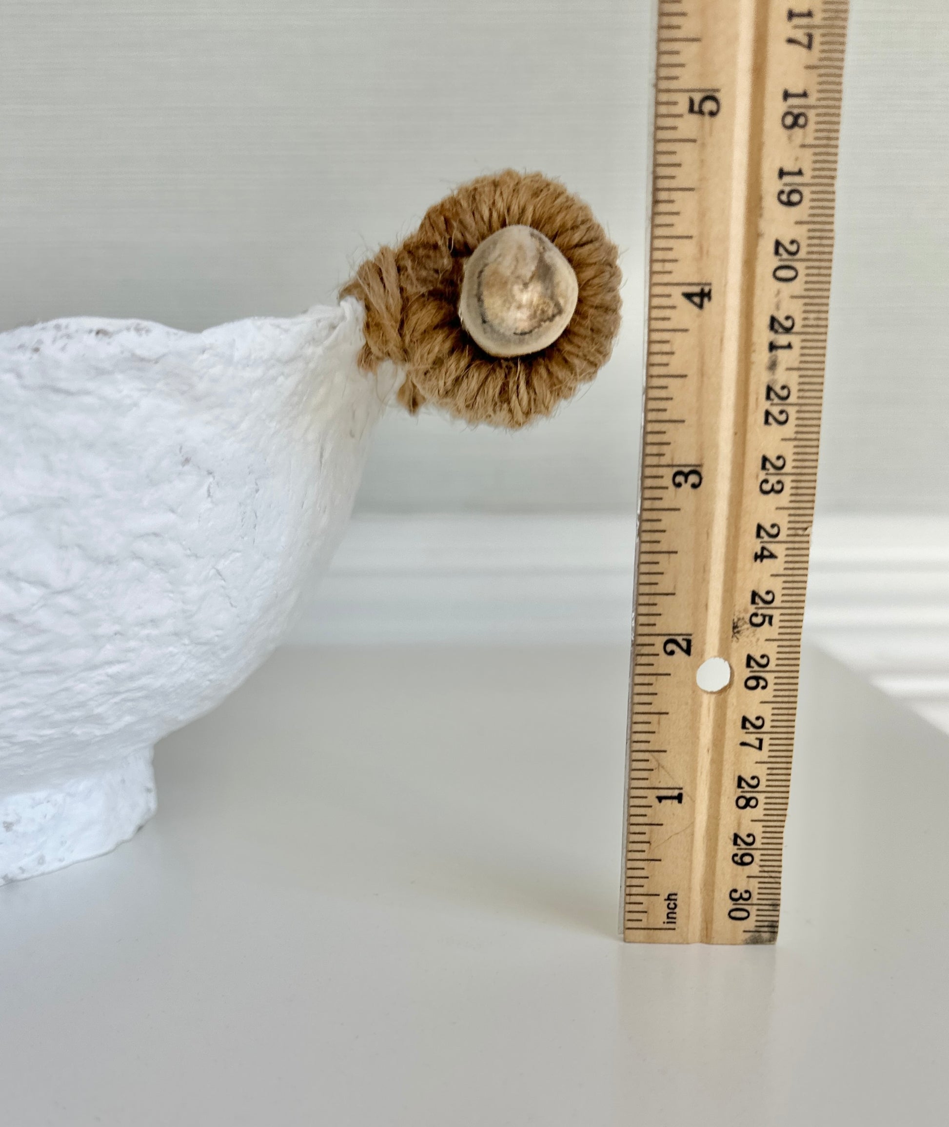 close up view of a handmade white paper mache bowl with driftwood and jute handles displaying total height at 4.5 inches. Designed by Artist Tam M Olson.
