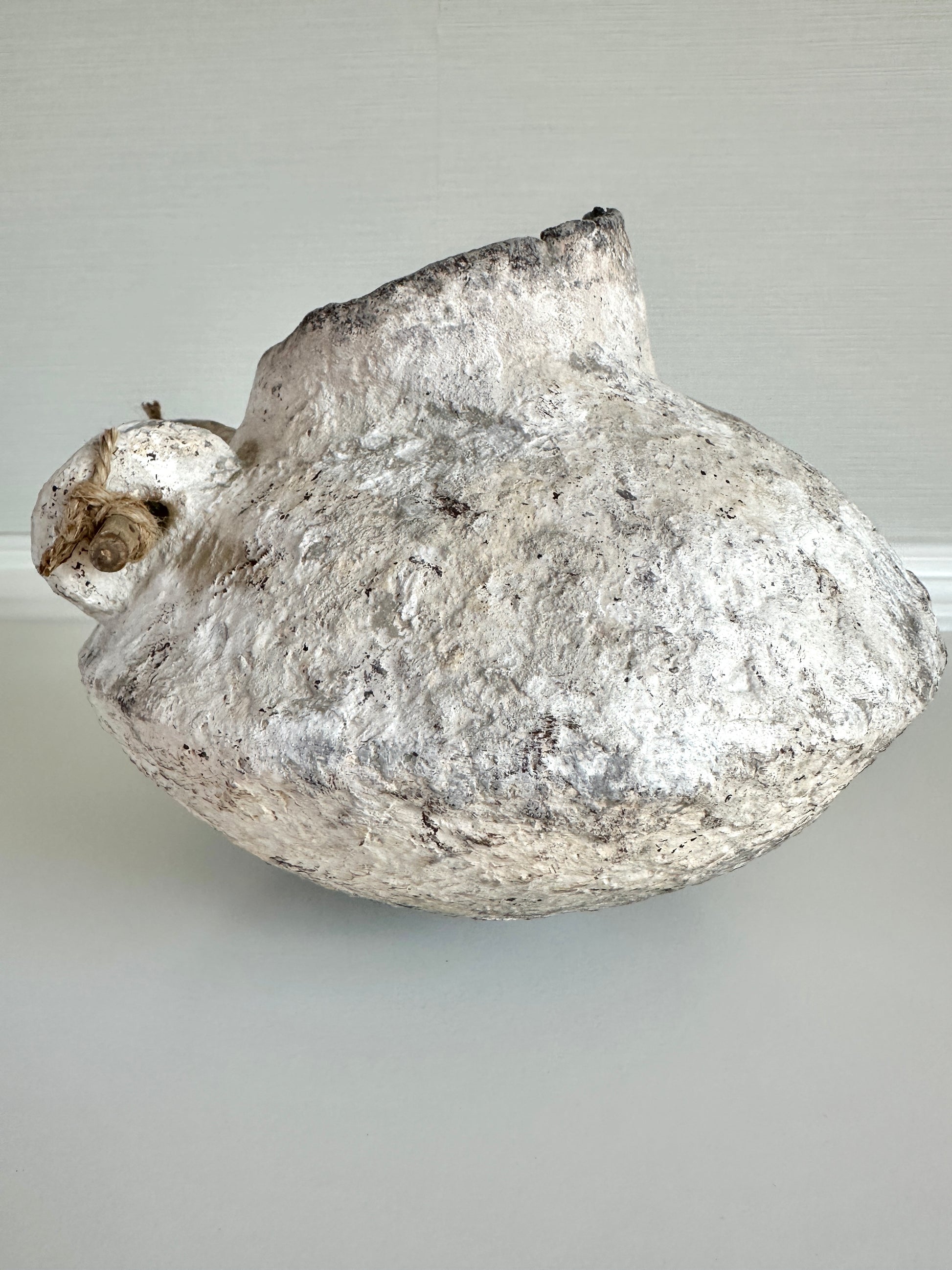 Decorative stone like sculpture on a plain background. Handcrafted original design by artist Tam M Olson