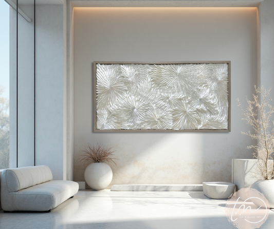 A framed dimensional abstract origami wall art displayed above a seating area with neutral color scheme. Commercial wall art by artist Tam M Olson.