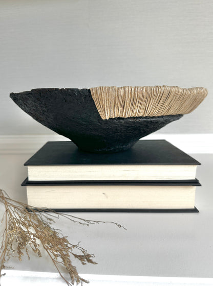 Decorative Black Bowl with Jute Twine and Wide Disposition on top of a small stack of books. Hand Made Paper Mache Bowl by Artist Tam M Olson.