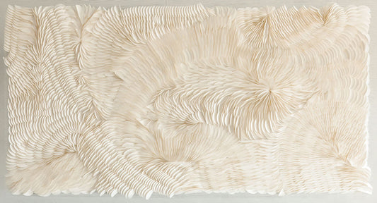 An unframed origami wall art piece with a flowing disposition in a white color scheme. Original artwork by Artist Tam M Olson