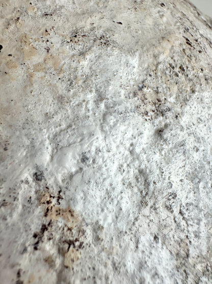 Close-up of a textured vase surface with gray, white and brown tones. Original design by artist Tam M Olson